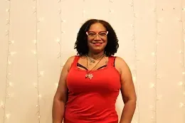 Bellydance class — hip isolations, shimmies and rhythm work for all levels. Bellydance student isolating hips mid-movement in a bellydance class at Flexibility in Flight in Chester, NY
